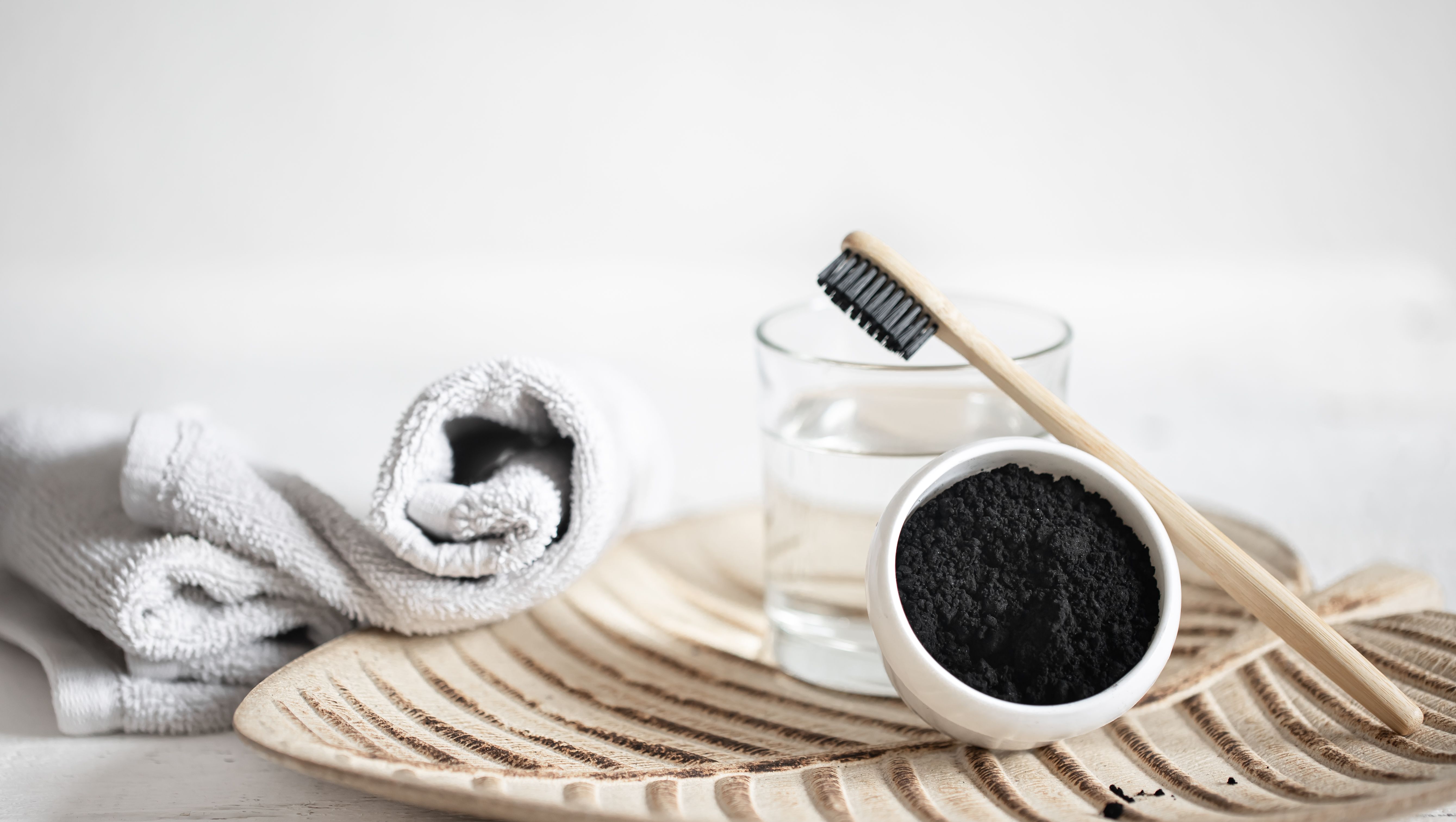 still-life-with-organic-wooden-toothbrush-with-glass-water-natural-teeth-whitening-powder-oral-hygiene-dental-care